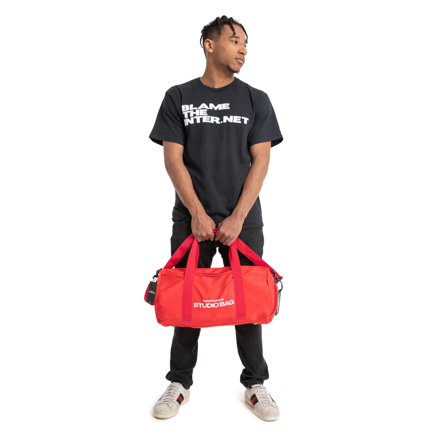 Wearing Blame the internet t-shirt and Holding Studio Bag Red