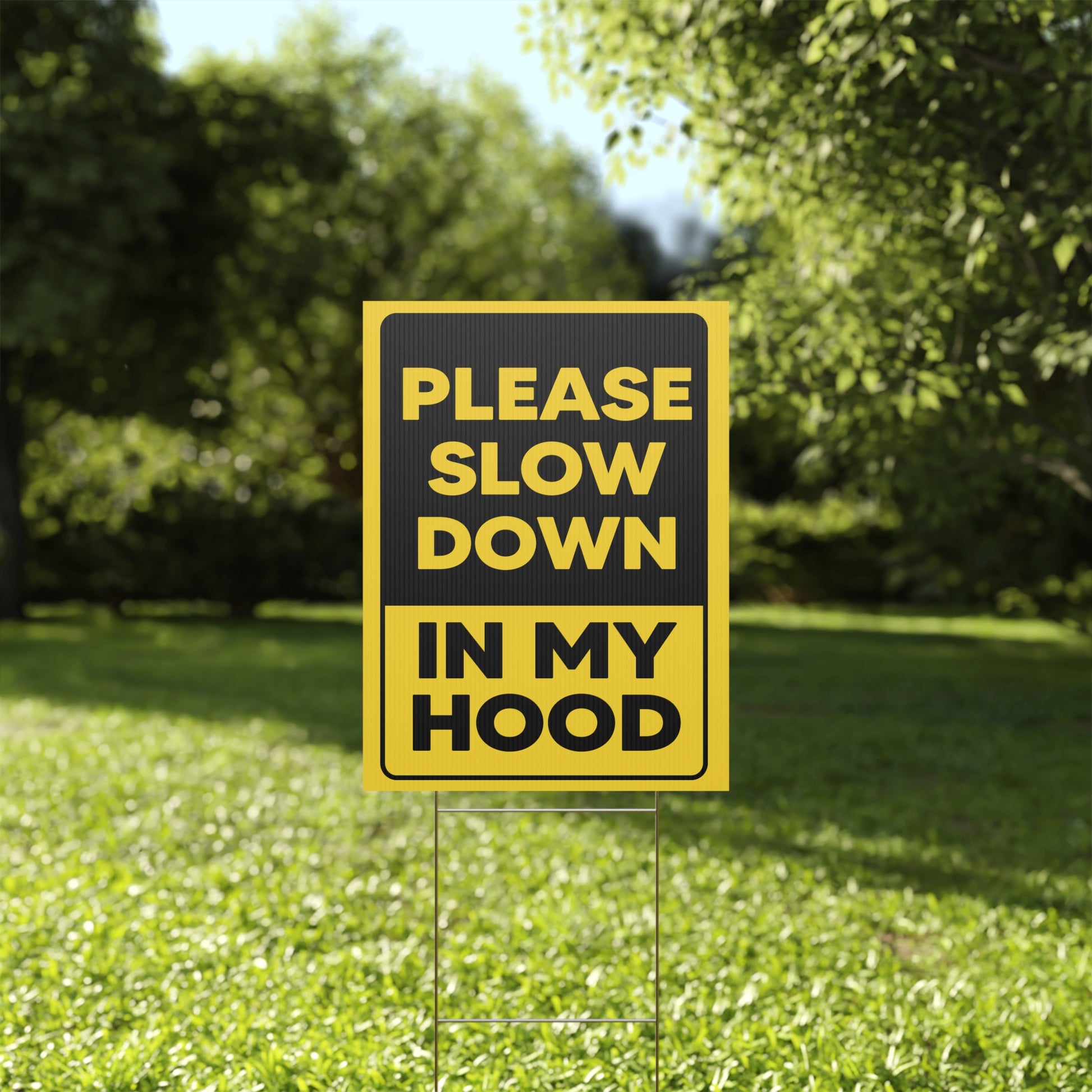 Please Slow Down In My Hood Yard Sign on a Yard