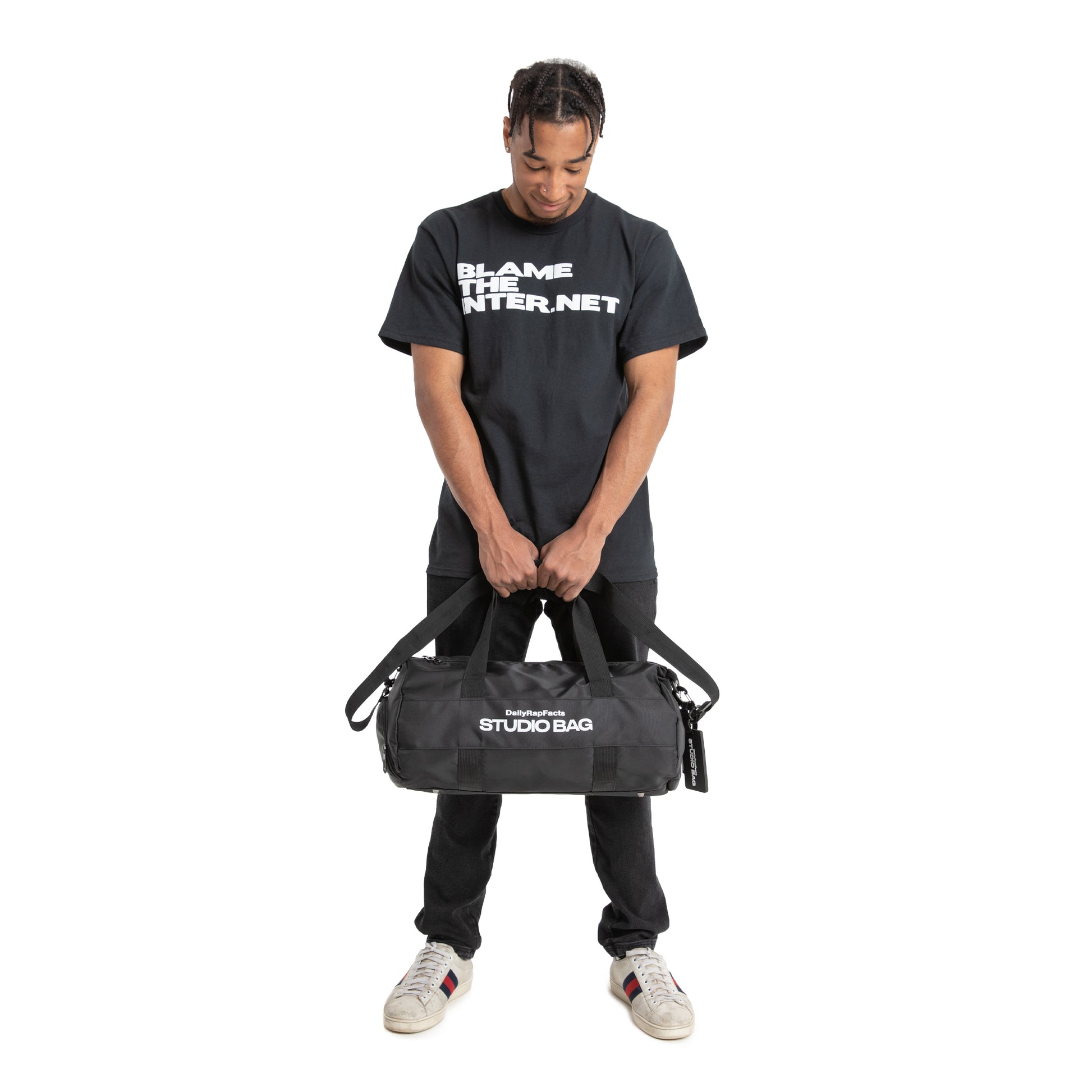 Holding Black Duffle Bag