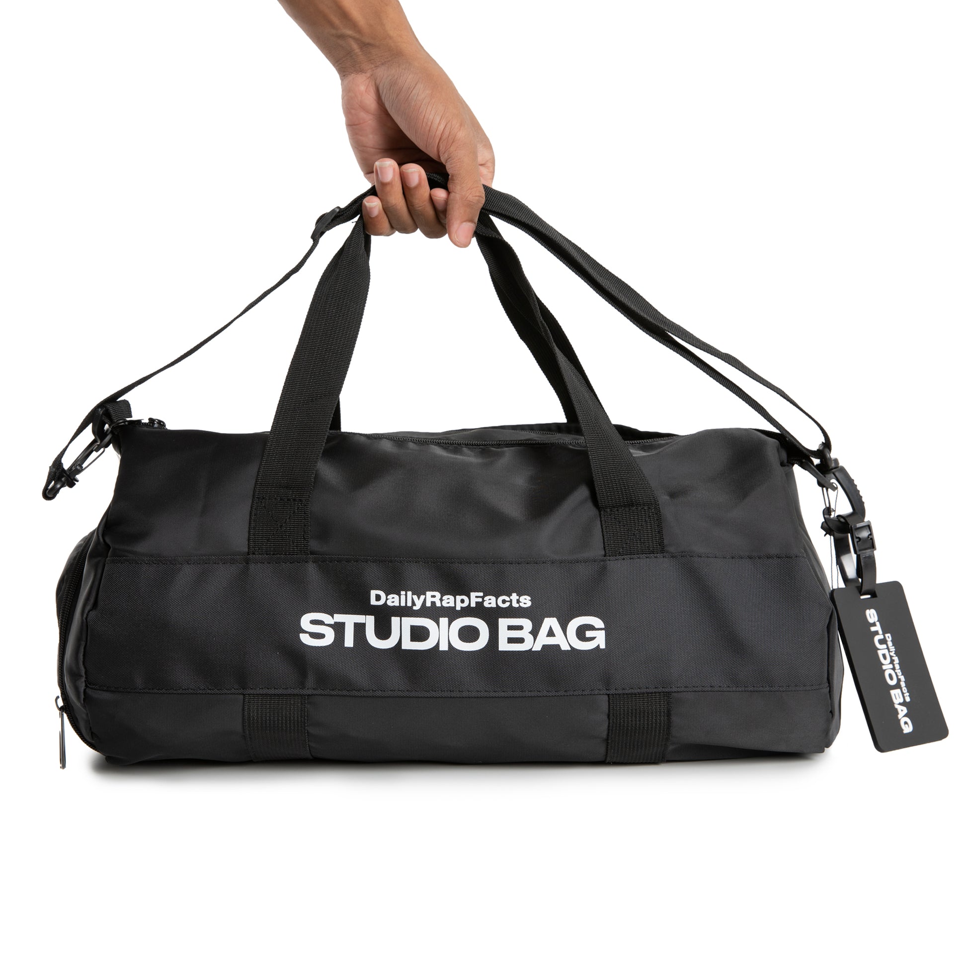 HOLDING BLACK STUDIO BAG
