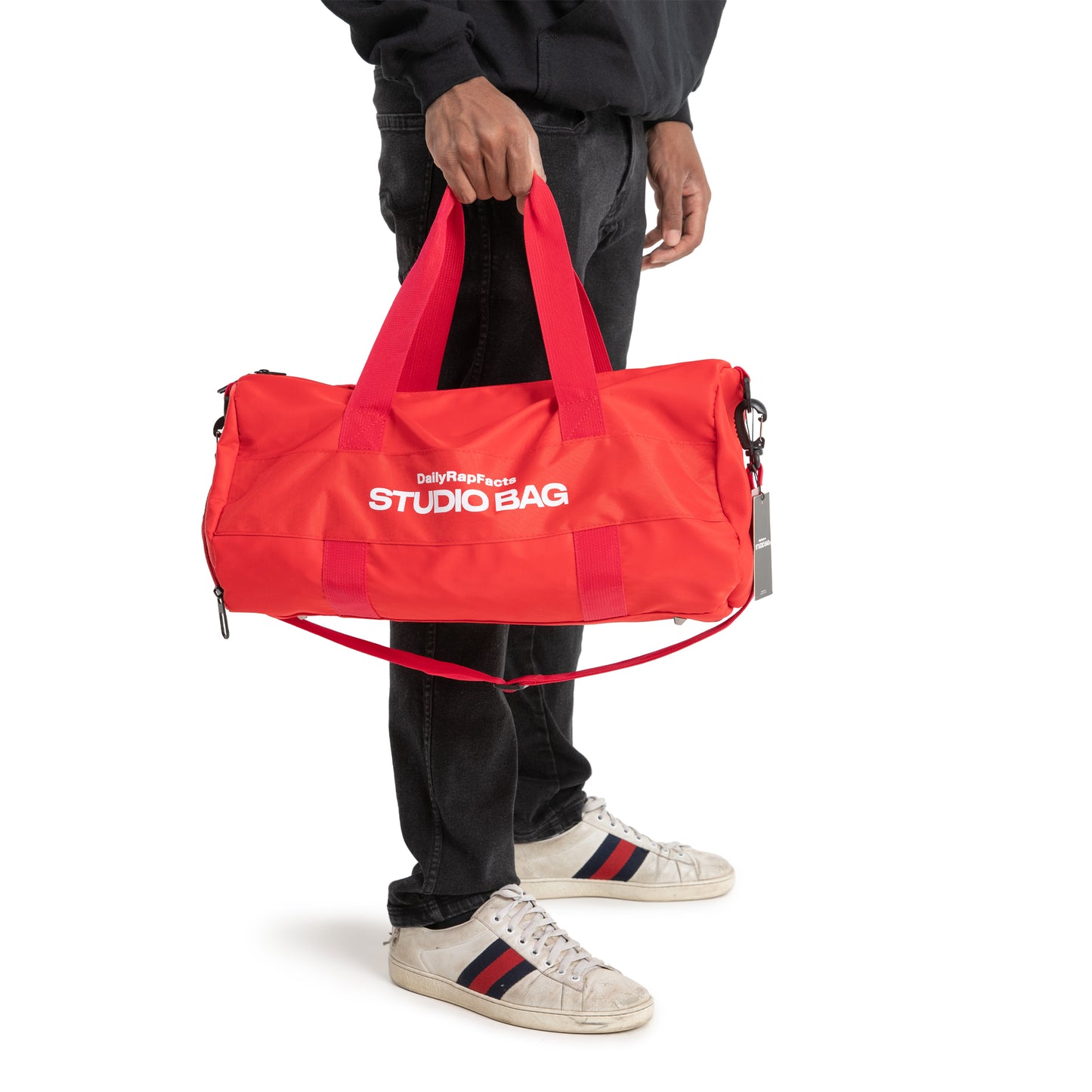 Holding Studio Bag by feet