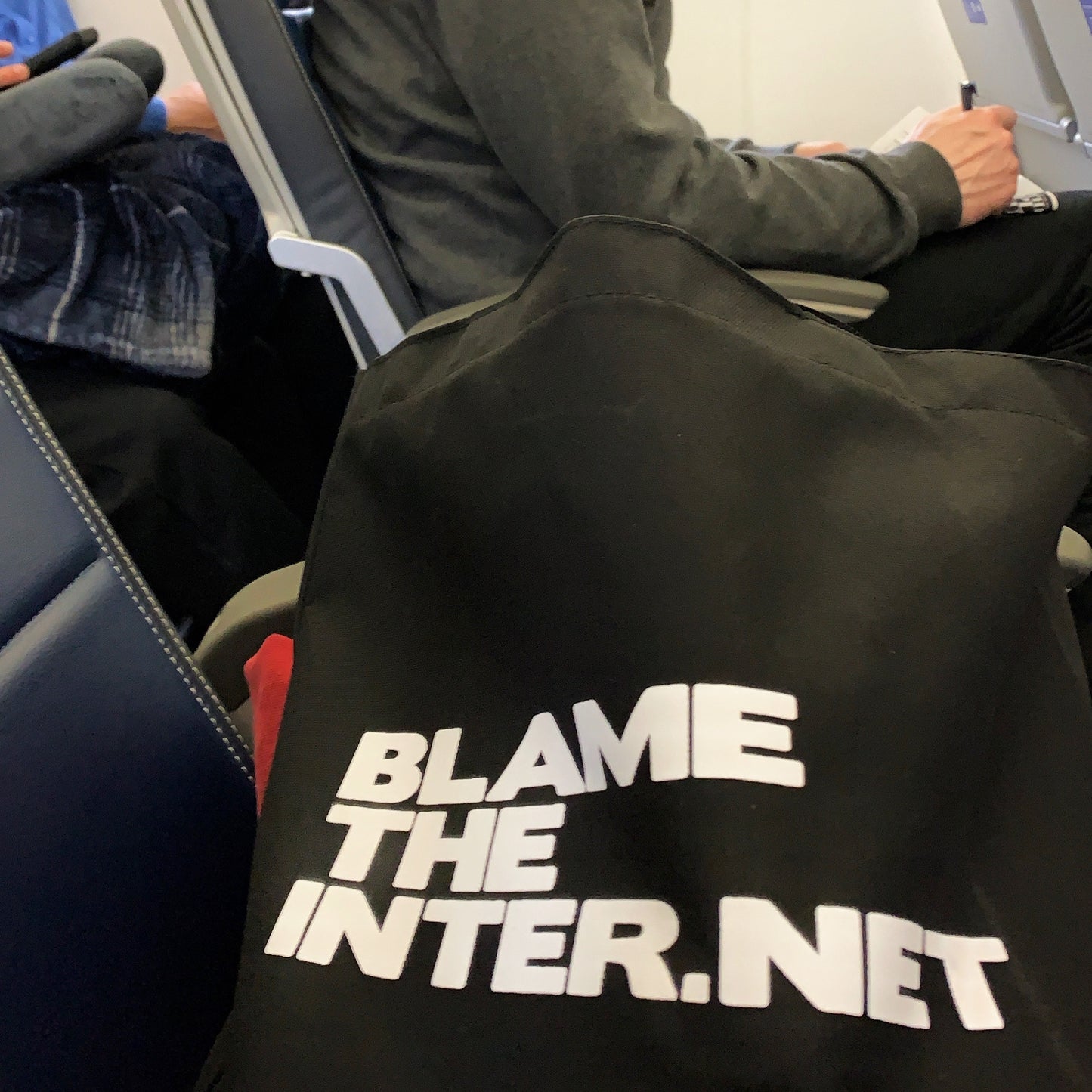 blametheinternet tote bag on plane